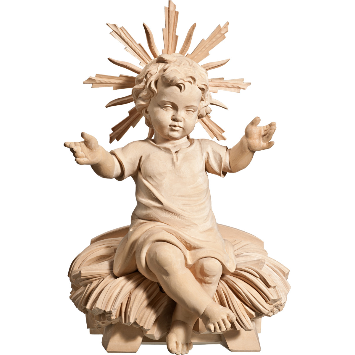 Niño Jesús vestido sentado en cuna